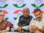Congress party president Mallikarjun Kharge and former presidents Sonia Gandhi and Rahul Gandhi during a special press conference at the Congress party headquarters in New Delhi, India, on Thursday. (Raj K Raj/ Hindustan Times)