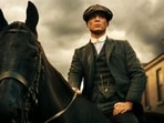Look to the character of Thomas Shelby of the TV show Peaky Blinders to suit up. 