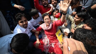 AAP leader and Delhi minister Atishi protests against CM Arvind Kejriwal’s arrest at ITO Chowk on Friday. (Sanchit Khanna/HT Photo) AAP leader and Delhi minister Atishi protests against CM Arvind Kejriwal’s arrest at ITO Chowk on Friday. (Sanchit Khanna/HT Photo)