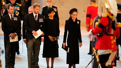 Queen Elizabeth II's Funeral: Prince Harry, Meghan, the Duchess of Sussex, Kate, Princess of Wales follow the bearer party carrying the coffin of Queen Elizabeth II. (AP)