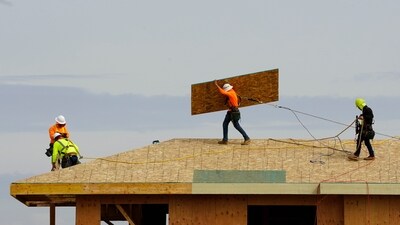 FILE - Work is done on the roof of a building under construction in Sacramento, Calif., on March 3, 2022. New numbers released Friday, March 22, 2024, show California has the highest unemployment rate in the country. Job losses in February were led by a drop in the construction industry. (AP Photo/Rich Pedroncelli, File) (AP)