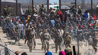Illegal immigrants broke down border fencing and assaulted border security guards amid standoff over Texas law (Reuters) Illegal immigrants broke down border fencing and assaulted border security guards amid standoff over Texas law (Reuters)