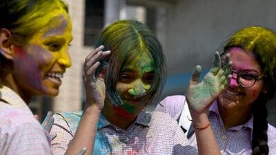 School students in Noida indulge in a bit of Holi fun and colours after class on Friday. (Sunil Ghosh/HT) School students in Noida indulge in a bit of Holi fun and colours after class on Friday. (Sunil Ghosh/HT)