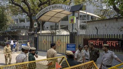 Security officers stand guard outside Enforcement Directorate office in the national Capital. (AP photo)