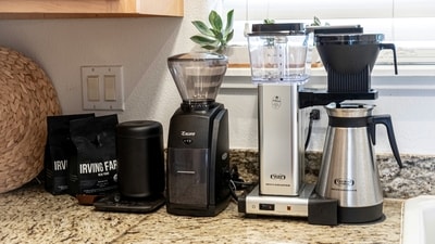 A stainless steel and black Crompton mixer grinder with multiple jars. (Unsplash)