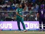 Pakistan's Imad Wasim, left, celebrates the dismissal of Scotland's Matthew Cross, right, during the Cricket Twenty20 World Cup match between Pakistan and Scotland in Sharjah, UAE, Sunday, Nov. 7, 2021 Pakistan's Imad Wasim, left, celebrates the dismissal of Scotland's Matthew Cross, right, during the Cricket Twenty20 World Cup match between Pakistan and Scotland in Sharjah, UAE, Sunday, Nov. 7, 2021