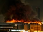 A view shows the burning Crocus City Hall concert hall following the shooting incident in Krasnogorsk, outside Moscow, on March 22, 2024 A view shows the burning Crocus City Hall concert hall following the shooting incident in Krasnogorsk, outside Moscow, on March 22, 2024