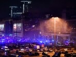 Emergency services personnel and servicemen are seen outside the Crocus City Hall concert hall following the shooting incident Emergency services personnel and servicemen are seen outside the Crocus City Hall concert hall following the shooting incident