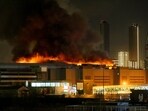 A view shows the burning Crocus City Hall concert hall following the shooting incident in Krasnogorsk, outside Moscow A view shows the burning Crocus City Hall concert hall following the shooting incident in Krasnogorsk, outside Moscow