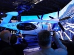 Visitors take pictures of the SK Telecom air taxi developed by US company Joby Aviation during the Mobile World Congress (MWC), the telecom industry's biggest annual gathering, in Barcelona on February 26, 2024. Dubai set to host world's first flying taxi service with air taxi startup Joby Aviation. 