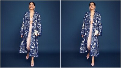 Her outfit was from ERDEM and consisted of a pastel bralette top and a matching maxi skirt with lovely floral embellishments. Her long blue and white printed cape added the perfect pop of colour to her look. (Instagram/@sonamkapoor) Her outfit was from ERDEM and consisted of a pastel bralette top and a matching maxi skirt with lovely floral embellishments. Her long blue and white printed cape added the perfect pop of colour to her look. (Instagram/@sonamkapoor)