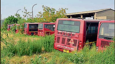 City buses parked in a yard in the Tajpur area of Ludhiana on Saturday. (HT Photo)