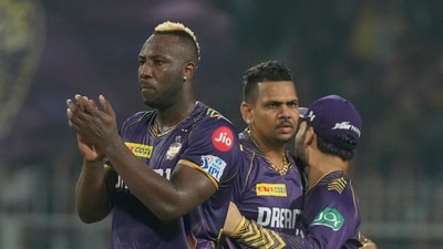 Kolkata Knight Riders' Sunil Narine, centre, Andre Russell, left, celebrates the dismissal of Sunrisers Hyderabad's Rahul Tripathi. (AP)