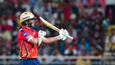 Punjab Kings' Sam Curran reacts after completing a half-century (PTI) Punjab Kings' Sam Curran reacts after completing a half-century (PTI)