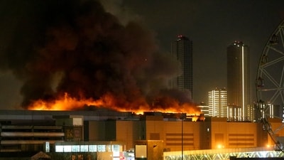 A view shows the burning Crocus City Hall concert hall following the shooting incident in Krasnogorsk, outside Moscow, on March 22, 2024 (AFP) A view shows the burning Crocus City Hall concert hall following the shooting incident in Krasnogorsk, outside Moscow, on March 22, 2024 (AFP)