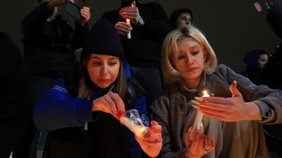 People light candles in memory of the victims of the terrorist attack in Moscow, in the center of in the center of Simferopol, in Russian-held Crimea on Friday. (AP) People light candles in memory of the victims of the terrorist attack in Moscow, in the center of in the center of Simferopol, in Russian-held Crimea on Friday. (AP)