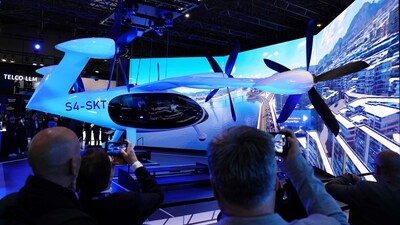 Visitors take pictures of the SK Telecom air taxi developed by US company Joby Aviation during the Mobile World Congress (MWC), the telecom industry's biggest annual gathering, in Barcelona on February 26, 2024. Dubai set to host world's first flying taxi service with air taxi startup Joby Aviation. (Photo by PAU BARRENA / AFP) Visitors take pictures of the SK Telecom air taxi developed by US company Joby Aviation during the Mobile World Congress (MWC), the telecom industry's biggest annual gathering, in Barcelona on February 26, 2024. Dubai set to host world's first flying taxi service with air taxi startup Joby Aviation. (Photo by PAU BARRENA / AFP)