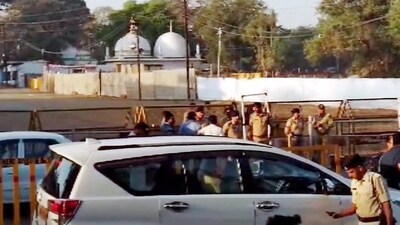 Security personnel stand guard outside Bhojshala/Kamal Maula Mosque complex after a team of the Archaeological Survey of India (ASI) reached the complex for a survey in Dhar on Friday. (PTI)