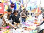 Streets across the country were dotted with make-shift shops selling gulal, colours, toys, and other decor.(HT Photo/Santosh Kumar)