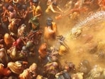 Women beat men with torn clothes during 
