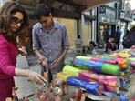 Tourists join Holi frenzy: Delhi markets abuzz with last-minute shoppers for colours, water guns and political masks