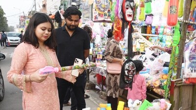 People buy 'pichkari' ahead of Holi festival at a shop in Patna, Bihar,. (HT Photo/Santosh Kumar)