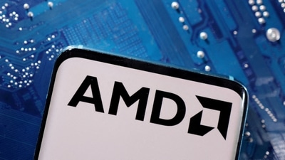 A smartphone with a displayed AMD logo is placed on a computer motherboard in this illustration. (Reuters)