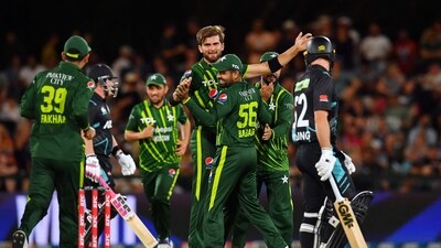 Pakistan's T20I captain Shaheen Shah Afridi (C) celebrates with former captain Babar Azam after the wicket of New Zealand's Tim Seifert during NZ T20I series (AFP)