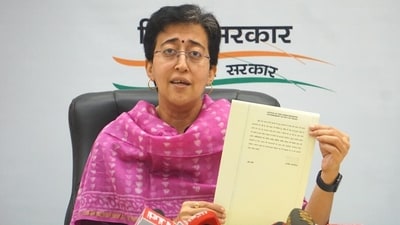 Delhi cabinet minister Atishi shows chief minister Arvind Kejriwal's direction from ED custody on resolving the city’s water concerns during a press conference in Delhi on Sunday. (PTI) Delhi cabinet minister Atishi shows chief minister Arvind Kejriwal's direction from ED custody on resolving the city’s water concerns during a press conference in Delhi on Sunday. (PTI)