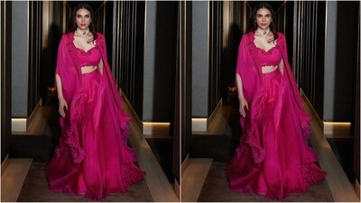 Her outfit comes in a beautiful shade of pink and features a luxurious chiffon fabric and a sweetheart neckline blouse adorned with enchanting floral embellishments. She teamed it with a matching flared skirt and a cape with a tasselled hemline to add a glamorous touch.&nbsp; (Instagram/@aditiraohydari)
