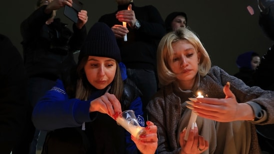 People light candles in memory of the victims of the terrorist attack in Moscow. (AP)