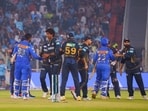 Players exchange handshakes after the match between Gujarat Titans and Mumbai Indians. Players exchange handshakes after the match between Gujarat Titans and Mumbai Indians.