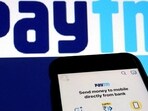 The interface of Indian payments app Paytm is seen in front of its logo displayed in this illustration picture.