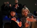 People light candles in memory of the victims of the terrorist attack in Moscow, in the center of in the center of Simferopol, in Russian-held Crimea on Friday.(AP)