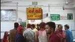 Relatives and family members outside the burn ward of a hospital where the people who were injured in a fire that broke out in the Mahakal temple are being treated in Ujjain. (PTI)