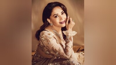 She styled her lustrous locks into soft curls and left them open at the sides, cascading beautifully down her shoulders and completing her stunning look. (Instagram/@madhuridixitnene) She styled her lustrous locks into soft curls and left them open at the sides, cascading beautifully down her shoulders and completing her stunning look. (Instagram/@madhuridixitnene)