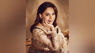 Assisted by make-up artist Billy Manik, Madhuri got decked up in nude eyeshadow, smoky eyeliner, mascara-covered eyelashes, darkened brows, contoured cheekbones, blushed cheeks, luminous highlighter and a shade of dark purple lipstick. (Instagram/@madhuridixitnene) Assisted by make-up artist Billy Manik, Madhuri got decked up in nude eyeshadow, smoky eyeliner, mascara-covered eyelashes, darkened brows, contoured cheekbones, blushed cheeks, luminous highlighter and a shade of dark purple lipstick. (Instagram/@madhuridixitnene)