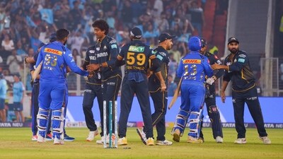 Players exchange handshakes after the match between Gujarat Titans and Mumbai Indians. (ANI) Players exchange handshakes after the match between Gujarat Titans and Mumbai Indians. (ANI)