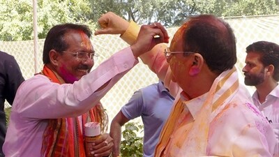 BJP National President JP Nadda with party candidate for Lok Sabha elections Harsh Malhotra during Holi celebrations at his residence, in New Delhi. (PTI)