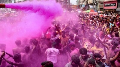 People play with colours during Holi celebrations, in Guwahati. (PTI)