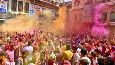 People play with colours on the occasion of Holi, in Pushkar. (PTI)