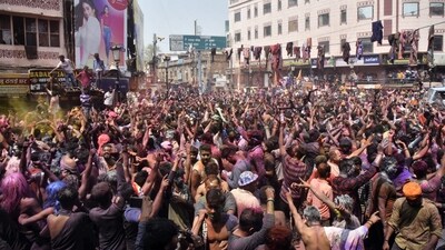People play with colours on the occasion of Holi festival, in Varanasi. (PTI)