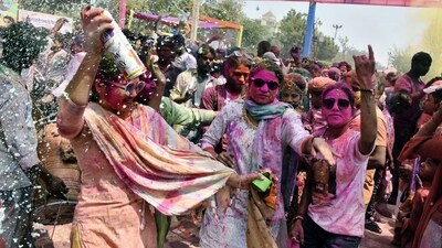 People play with colours during Holi festival celebrations, at Khatu Shyam temple in Lucknow. (PTI)