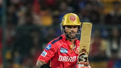PBKS got off to a fairly quick start largely thanks to Shikhar Dhawan. However, RCB did well to put the pressure right back on the batters in the first 10 overs (PTI) PBKS got off to a fairly quick start largely thanks to Shikhar Dhawan. However, RCB did well to put the pressure right back on the batters in the first 10 overs (PTI)