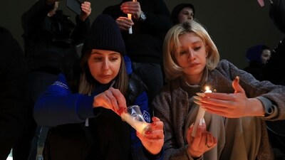 People light candles in memory of the victims of the terrorist attack in Moscow, in the center of in the center of Simferopol, in Russian-held Crimea on Friday. (AP) People light candles in memory of the victims of the terrorist attack in Moscow, in the center of in the center of Simferopol, in Russian-held Crimea on Friday. (AP)