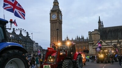 Farmers drive their tractors past the Houses of Parliament during a protest against issues including substandard food imports, in London, UK, on Monday, March 25, 2024. British farmers are joining their unhappy counterparts from across the globe who are trying influence policy in a year filled with elections. Photographer: Carlos Jasso/Bloomberg (Bloomberg) Farmers drive their tractors past the Houses of Parliament during a protest against issues including substandard food imports, in London, UK, on Monday, March 25, 2024. British farmers are joining their unhappy counterparts from across the globe who are trying influence policy in a year filled with elections. Photographer: Carlos Jasso/Bloomberg (Bloomberg)