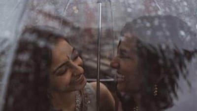 Pictures show Anjali Chakra from India and Sundas Malik from Pakistan under a rain-splattered umbrella. (Twitter/@Sarowarrrr) Pictures show Anjali Chakra from India and Sundas Malik from Pakistan under a rain-splattered umbrella. (Twitter/@Sarowarrrr)