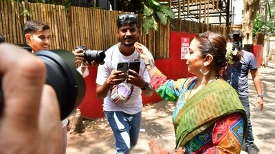 Divya Dutta speaks with and greets media persons outside Shabana Azmi's home in Mumbai. 