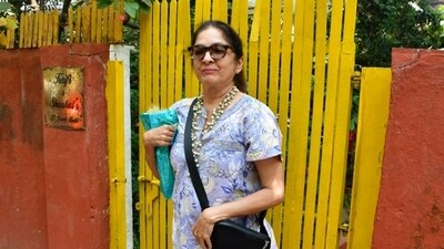 Neena Gupta smiles for the paparazzi at the bash. She is close friends with Shabana and Javed. 