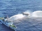 In this frame grab from aerial video footage taken on March 5, 2024 and released by the Philippine Coast Guard (PCG), Chinese Coast Guard ships (L and R) deploy water cannons at the Philippine military-chartered civilian boat Unaizah May 4 (C) during its supply mission near Second Thomas Shoal in the disputed South China Sea. In this frame grab from aerial video footage taken on March 5, 2024 and released by the Philippine Coast Guard (PCG), Chinese Coast Guard ships (L and R) deploy water cannons at the Philippine military-chartered civilian boat Unaizah May 4 (C) during its supply mission near Second Thomas Shoal in the disputed South China Sea.